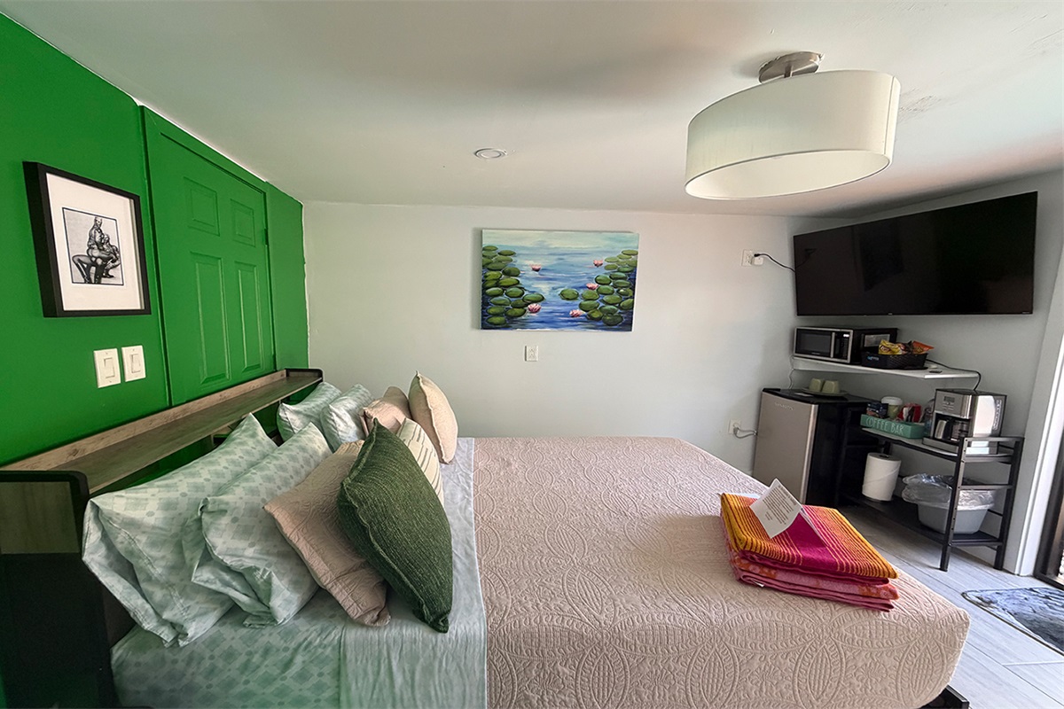 Queen bed, coffee station, and thoughtful amenities for your stay.