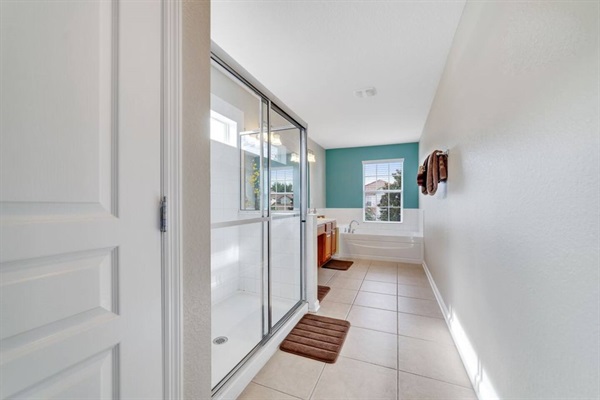 Large Master Bathroom with deep soaking tub, separate shower, and double sinks