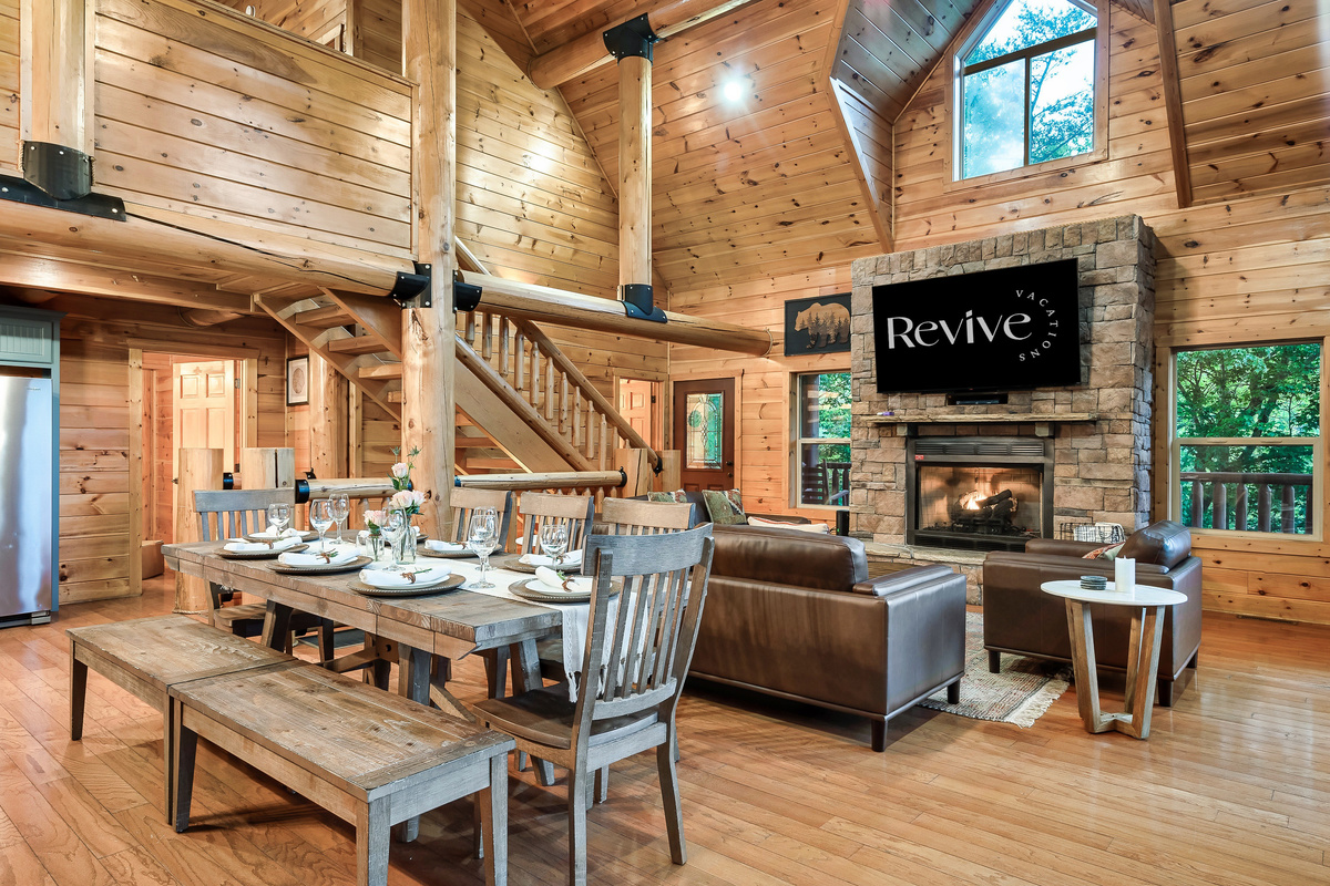 Large dining table with seating for 10, plus additional seating on the deck.