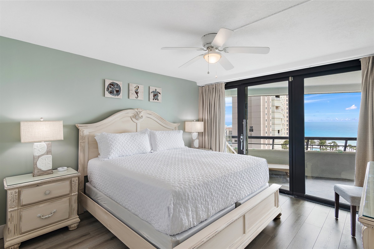 Primary bedroom which features Gulf Views, King Bed, Smart TV, Patio Access, and Private, REMODELED bathroom with walk in shower and dual vanity!