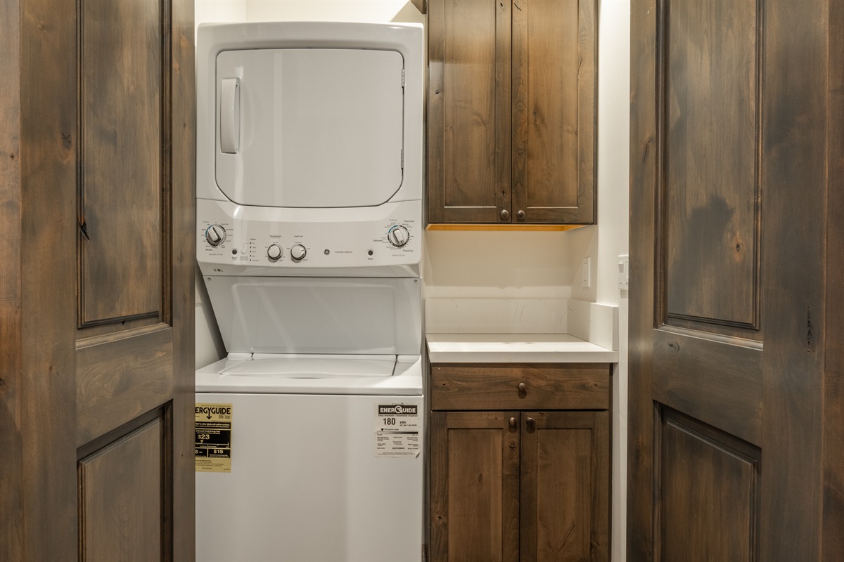 Conveniently located between the two primary bedrooms, the laundry area makes stays easy without disrupting the flow of the home.