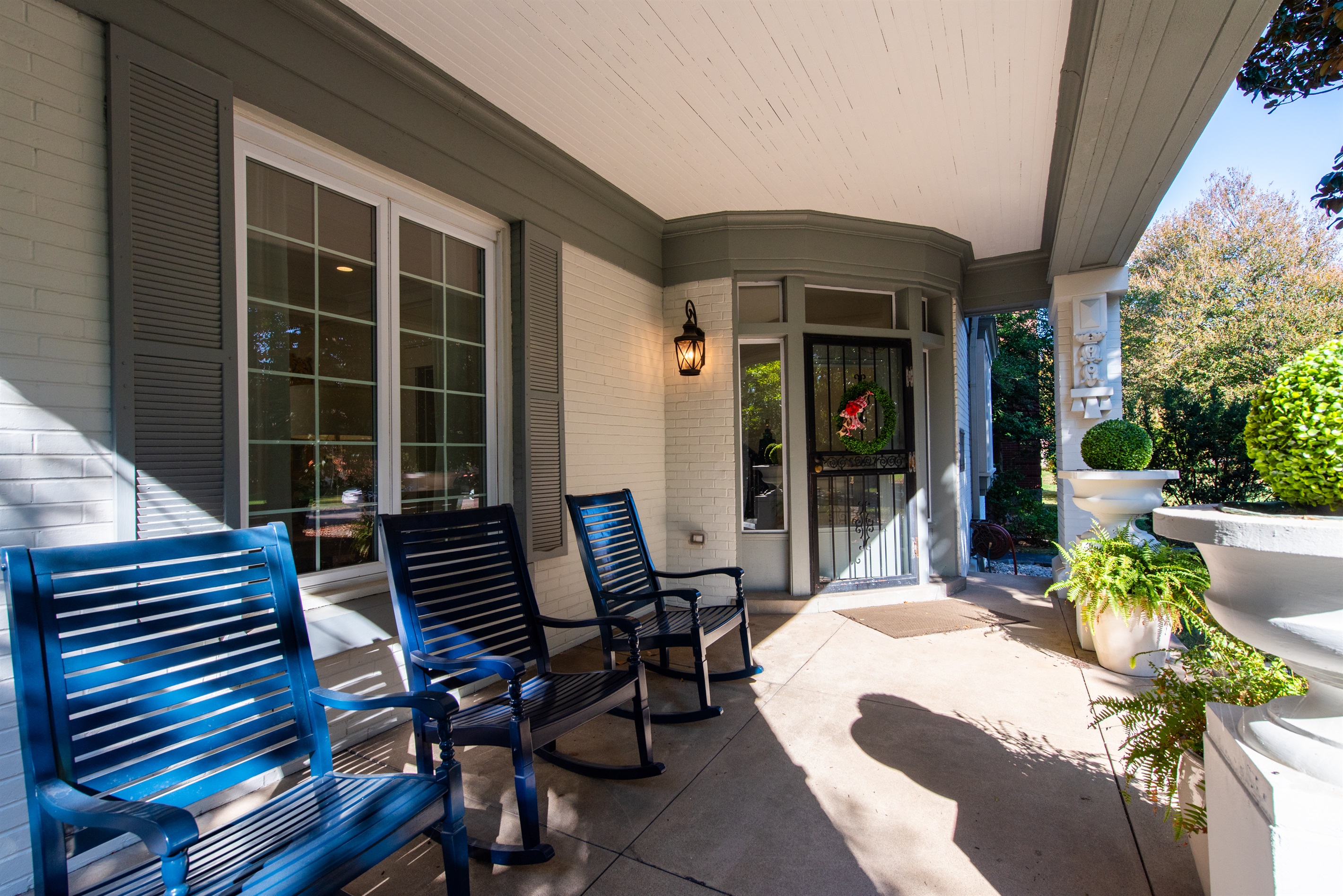 Front Porch with Rocking Chairs and a great view of 100+ Year Old Magnolia Trees.