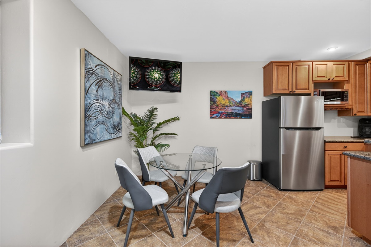 Additional lower-level dining nook beside kitchenette area ideal for morning coffee or late-night snacks