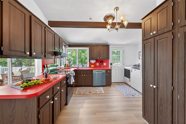 Warm and inviting kitchen featuring wood cabinets and modern appliances for a stylish and functional space.