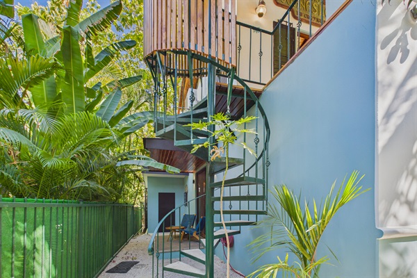 Outdoor covered spiral staircase to upstairs bedroom 5