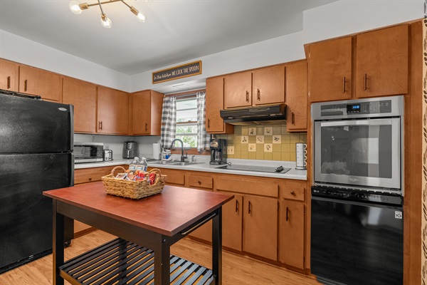 Kitchen: Fully stocked utensils and cookware. Microwave, drip coffee maker, air fryer, oven, stove, dishwasher, microwave