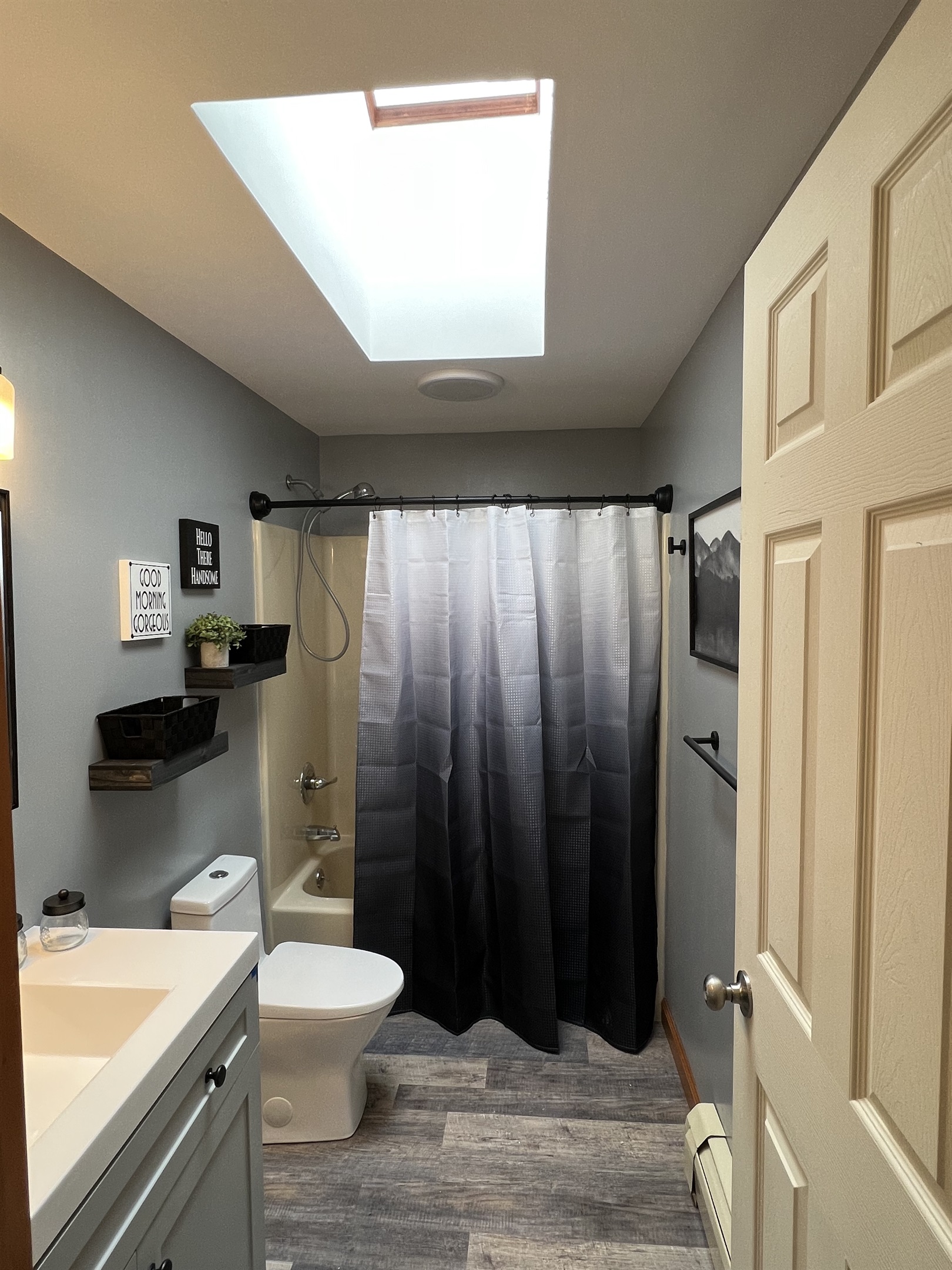 Full bathroom in hallway.