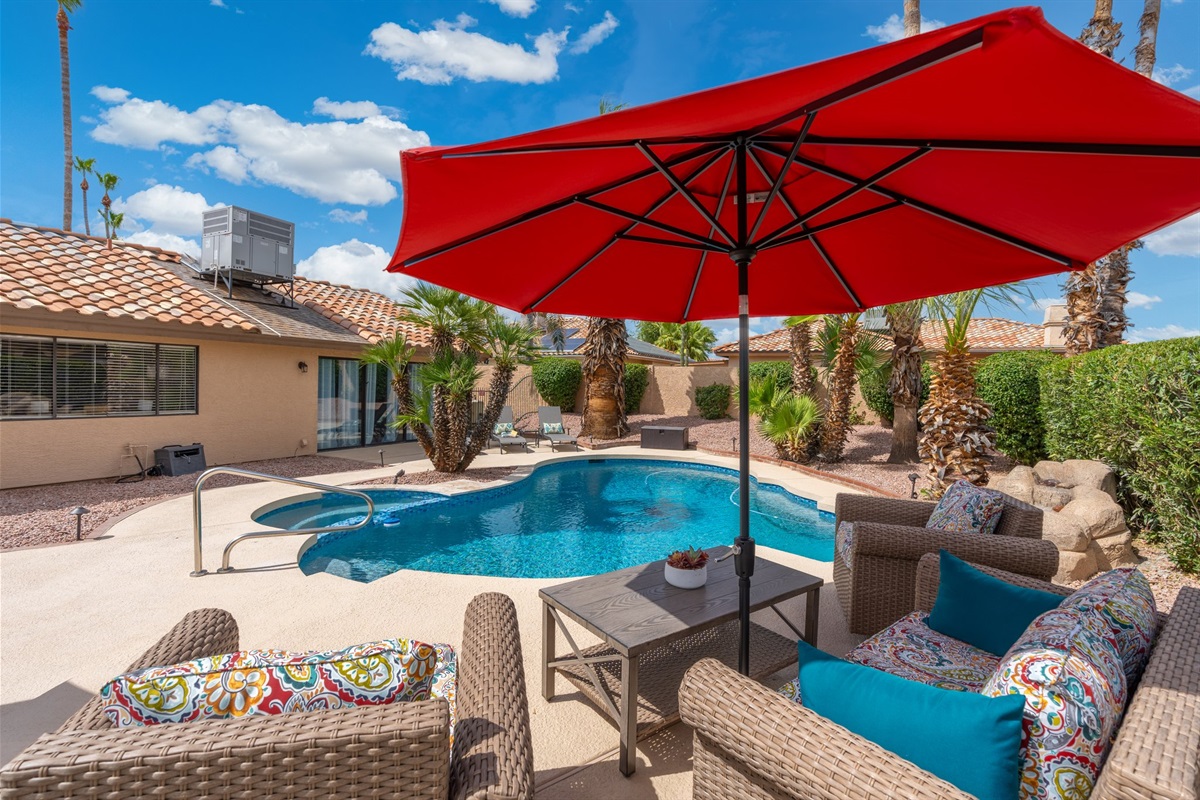 Perfection! Have a great viewpoint from this comfy, cozy sitting area next to the pool.
