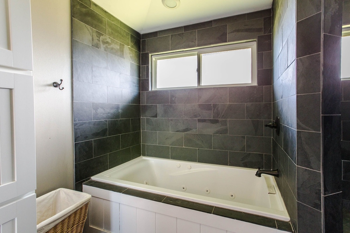 Custom river rock tile jetted tub