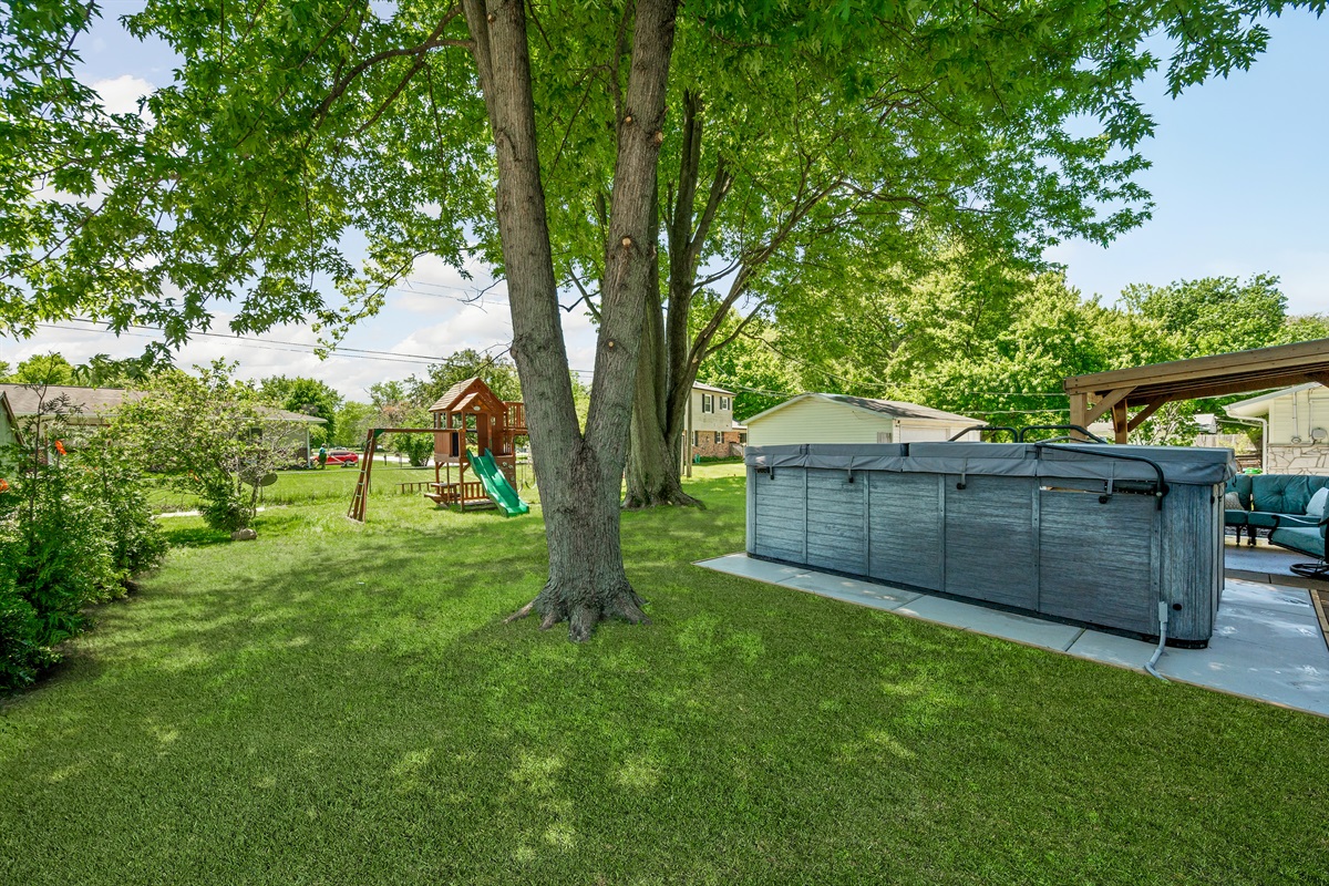 Guests can enjoy outdoor fun with a backyard playset for the kids and a relaxing swim spa perfect for unwinding after a busy day.
