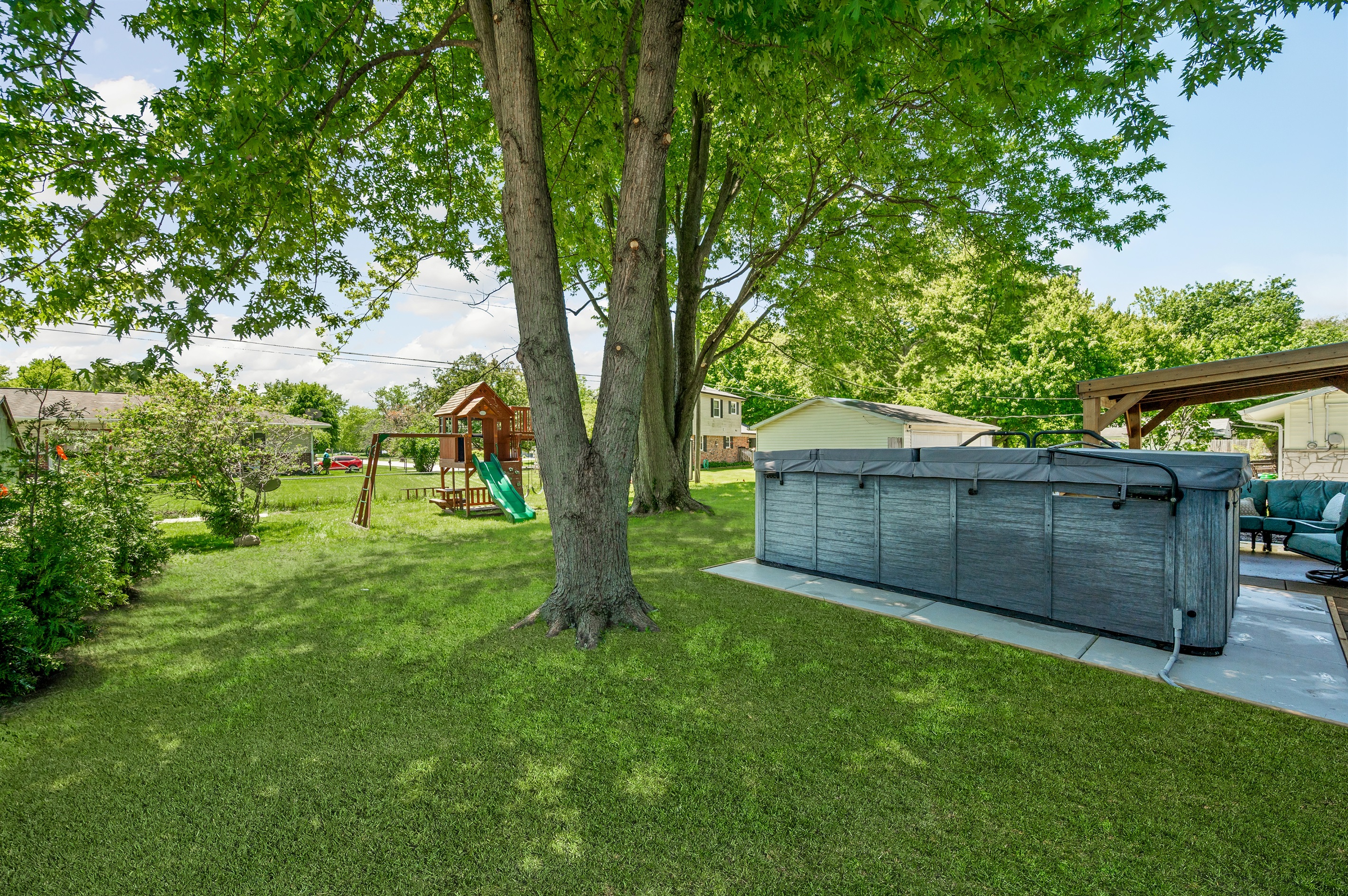 Guests can enjoy outdoor fun with a backyard playset for the kids and a relaxing swim spa perfect for unwinding after a busy day.
