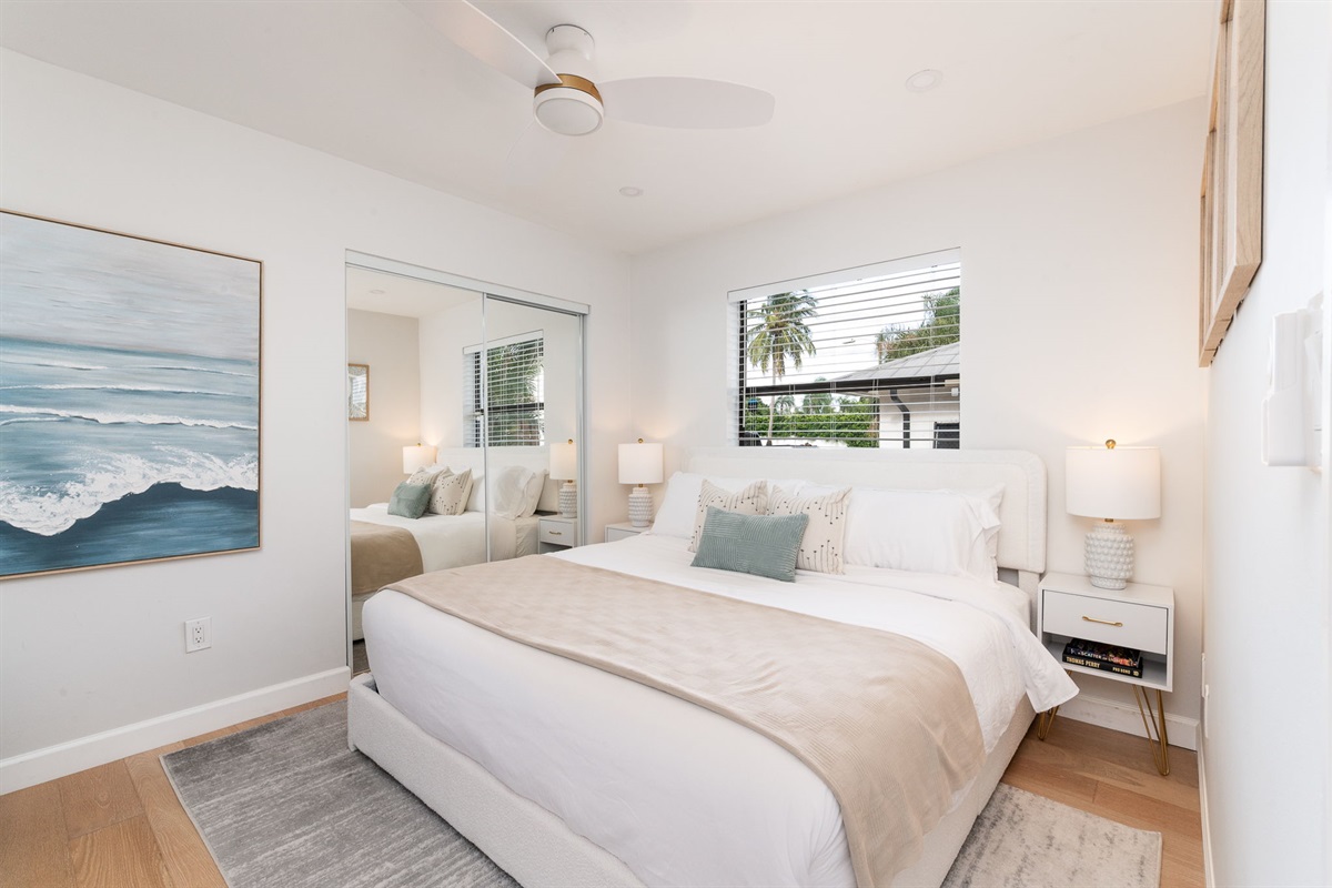 Third bedroom combines comfort and convenience with a king bed and large smart TV.