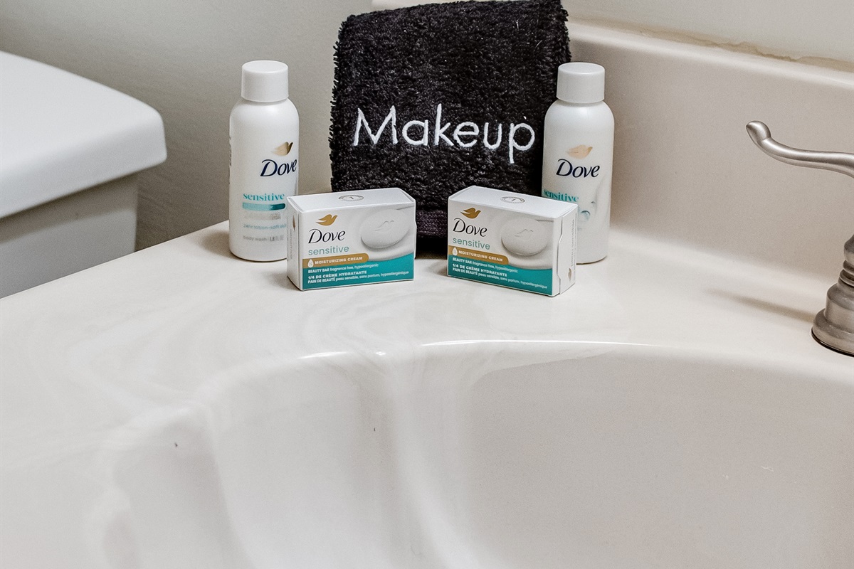 Bathroom Bliss: Dive into luxury with Dove amenities and a stylish makeup station!