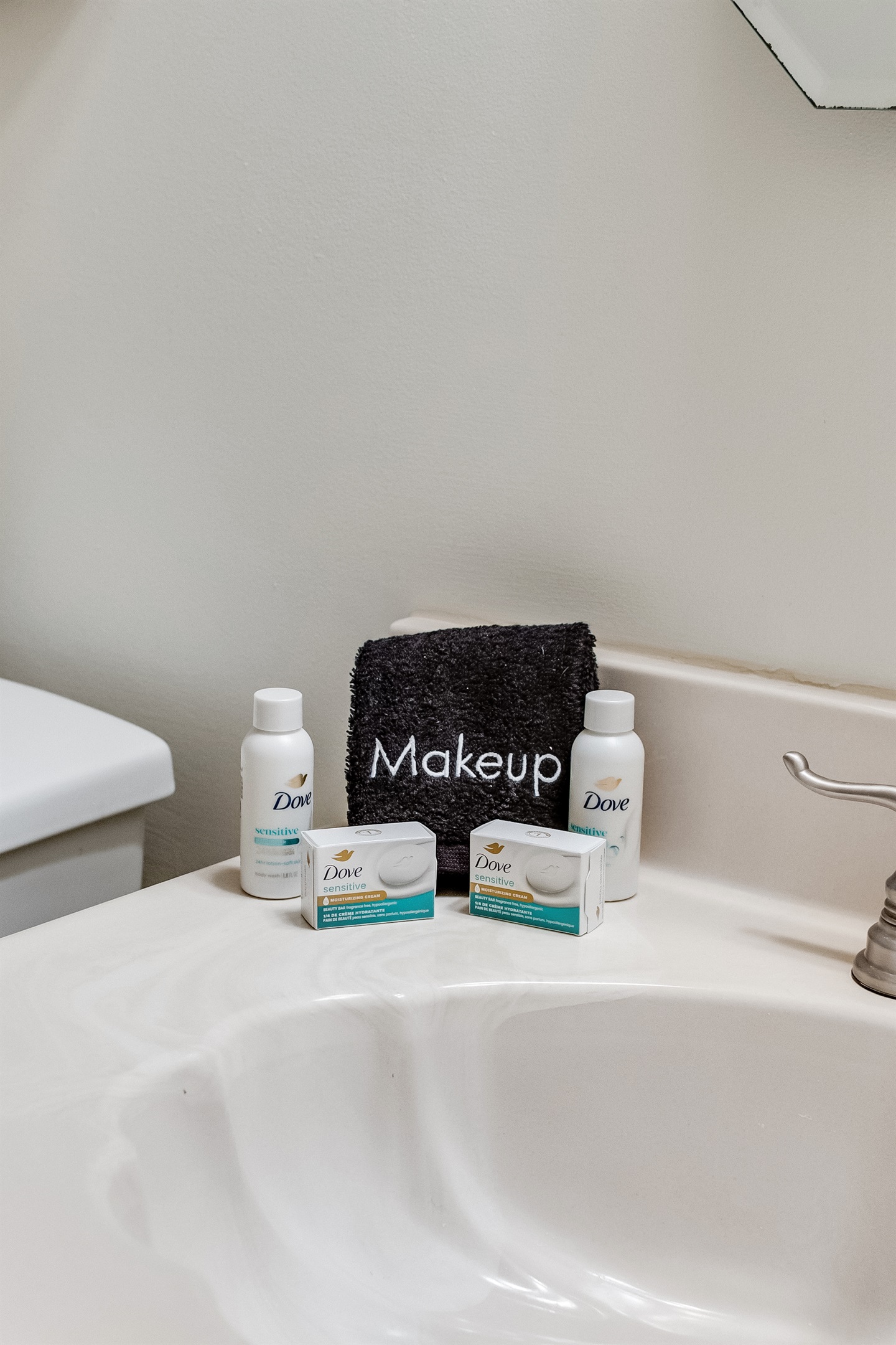 Bathroom Bliss: Dive into luxury with Dove amenities and a stylish makeup station!