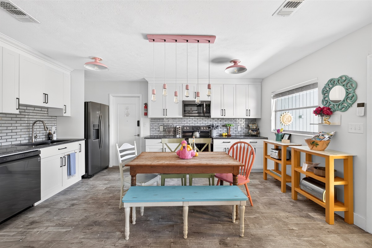 The living room has an open floor plan with adjacent kitchen and dining area.