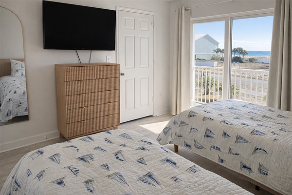  Two comfortable twin beds, smart TV, and natural light just steps from the beach.