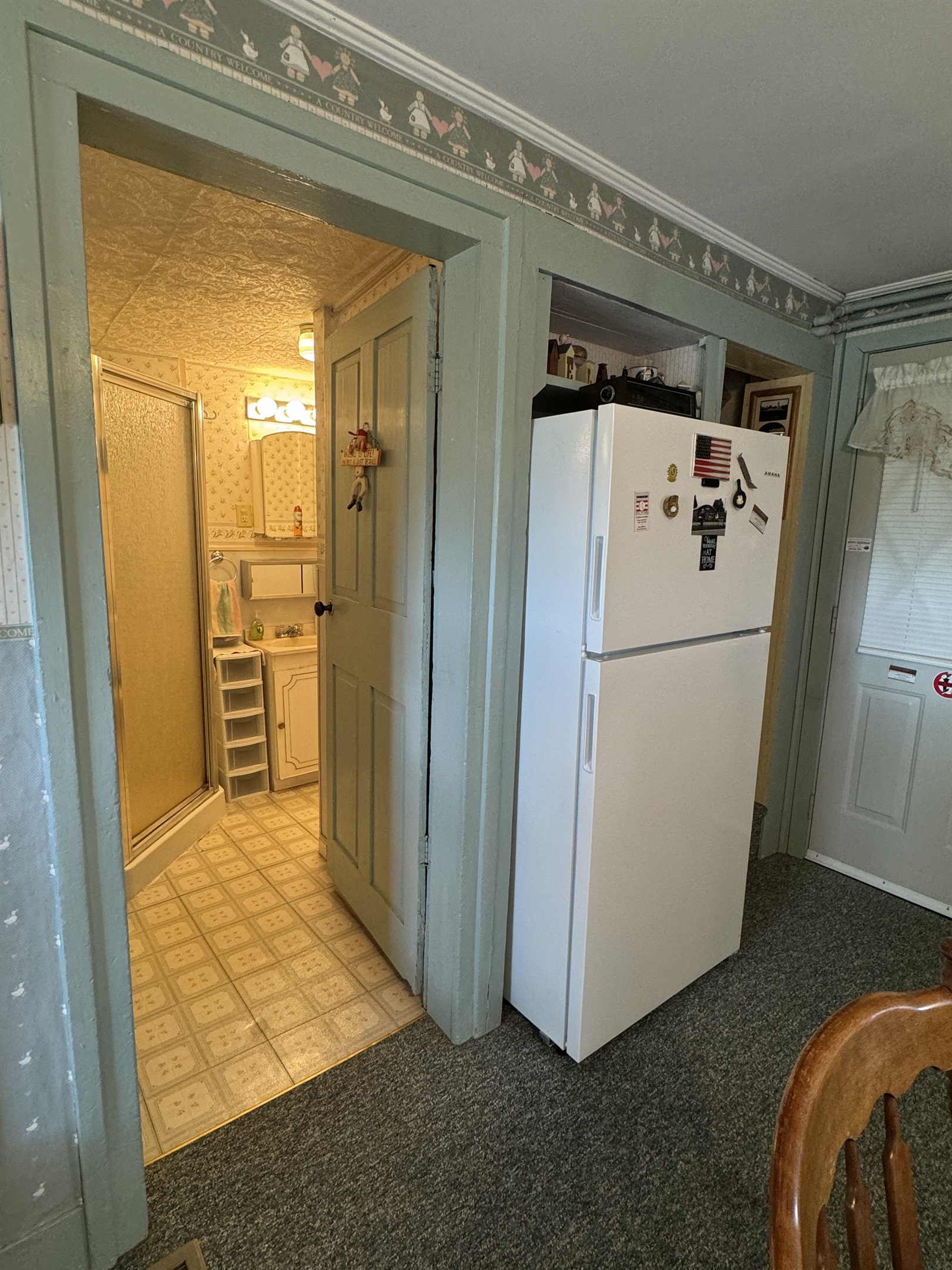 Bathroom with shower off kitchen