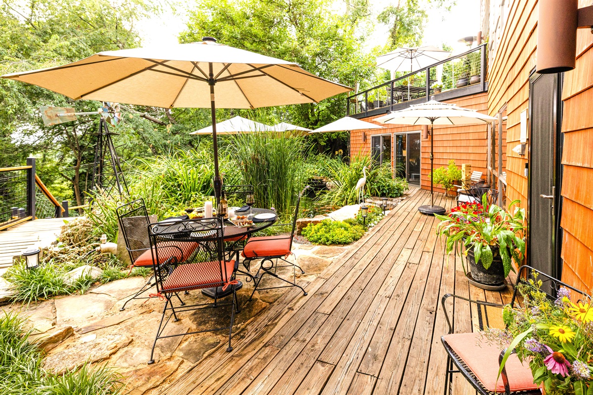 With the ground level deck, 7,000 gallon Koi Pond, linked both internally and outside, you can flow throughout Hilltop Oasis easily! And, use the stairs at left to the mid-level deck and lower lawn and gardens.