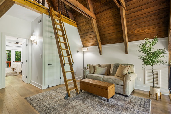 This loft space is a great spot to sit down, relax and read a book.The cozy sofa converts to a full size bed with memory foam mattress.The vintage library ladder is for access to the 3rd floor loft and its on a track and can slide left and right if needed.