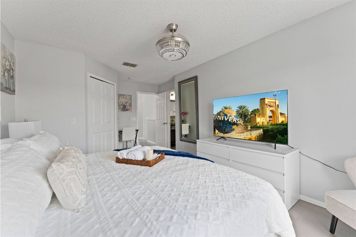 This master bedroom has its own TV and a private full unsuite bathroom.