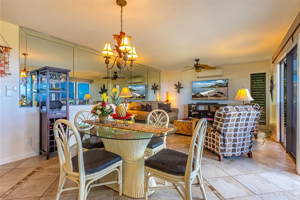 Living room and Dining area inside or out on the Lanai with a view of the ocean 