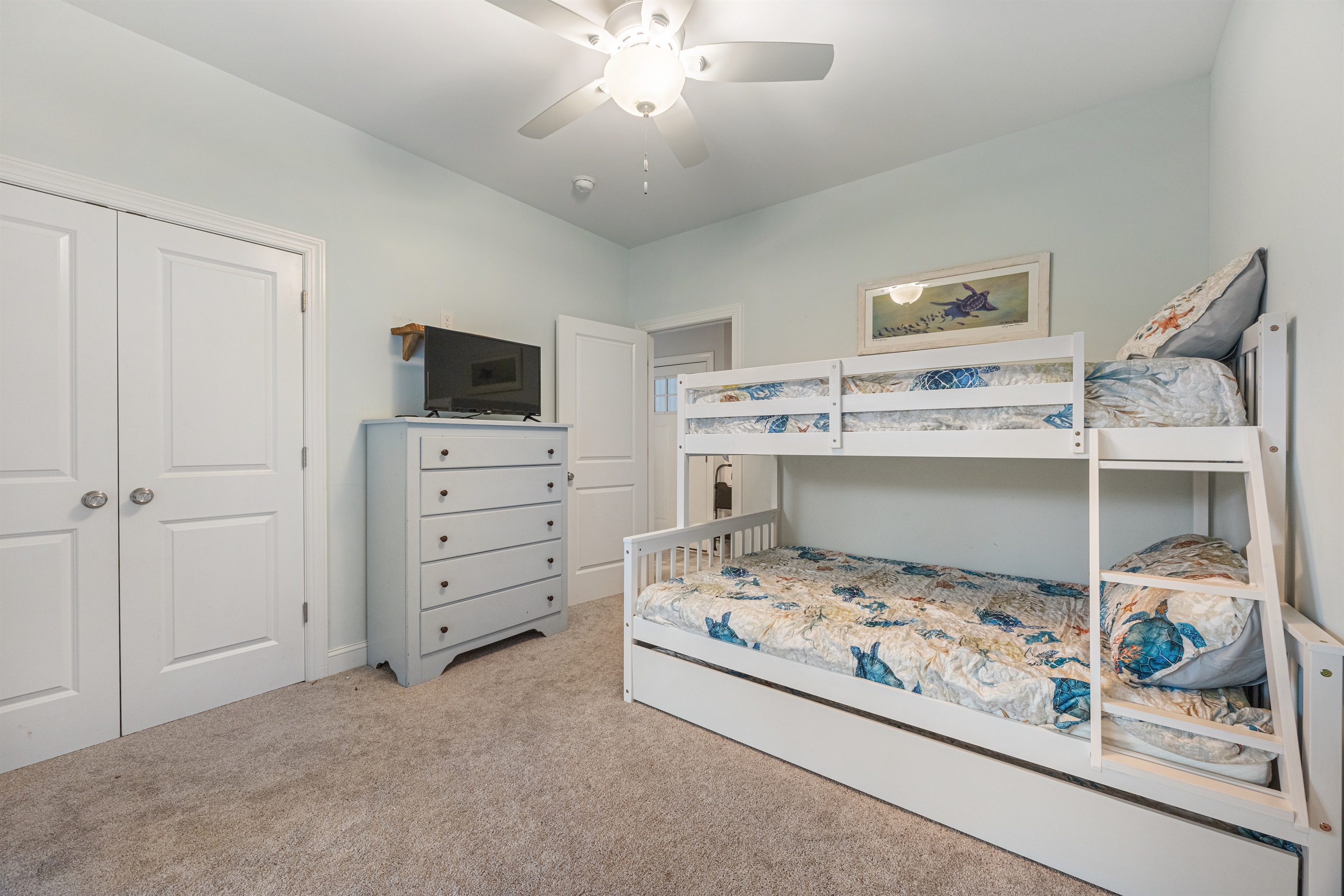 Cozy and fun—twin-over-full bunk bed with twin trundle