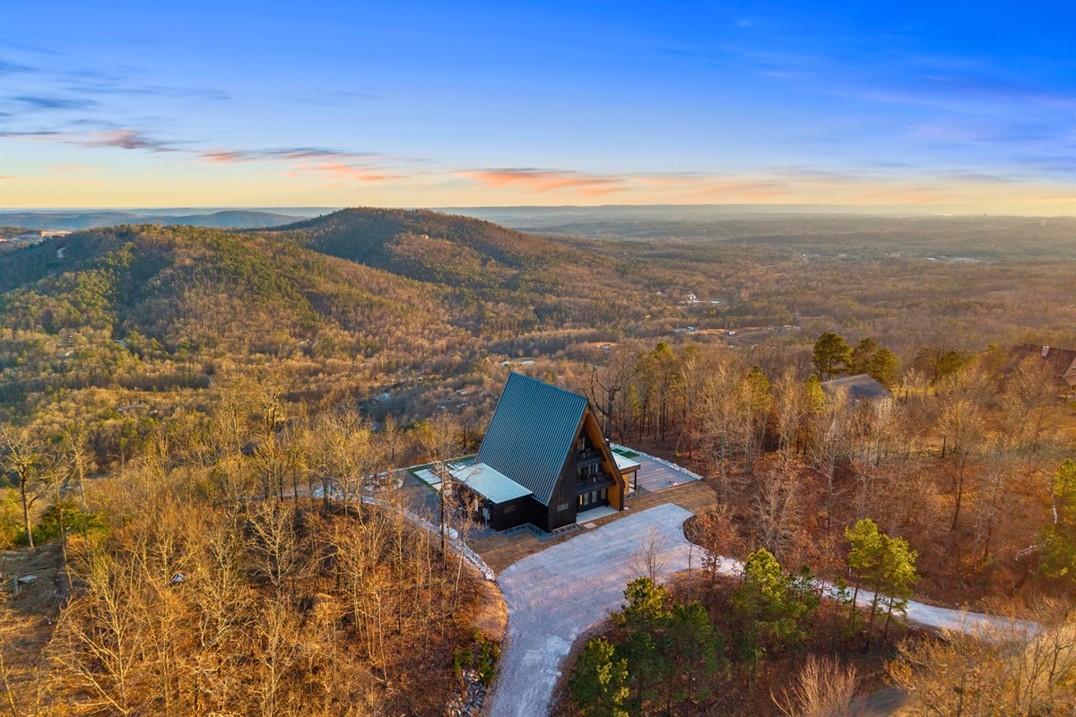 Take in the wide-open views from above, where the cabin feels completely tucked into nature with nothing but scenery in every direction.