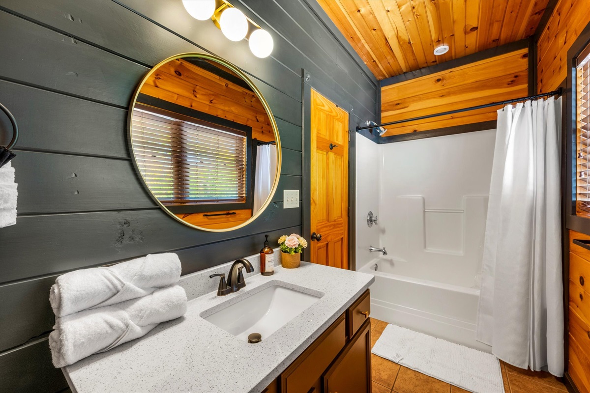 Bedroom 4 has a private bathroom with shower/tub