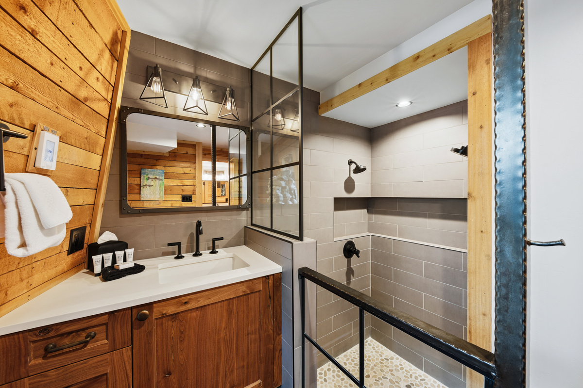 Primary Suite split-section bathroom. This section contains single vanity and walk-in shower