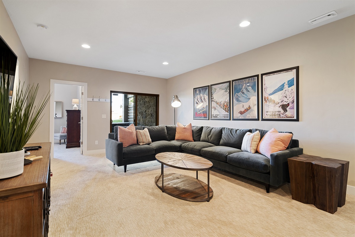 Spacious lower-level living area with oversized sectional.