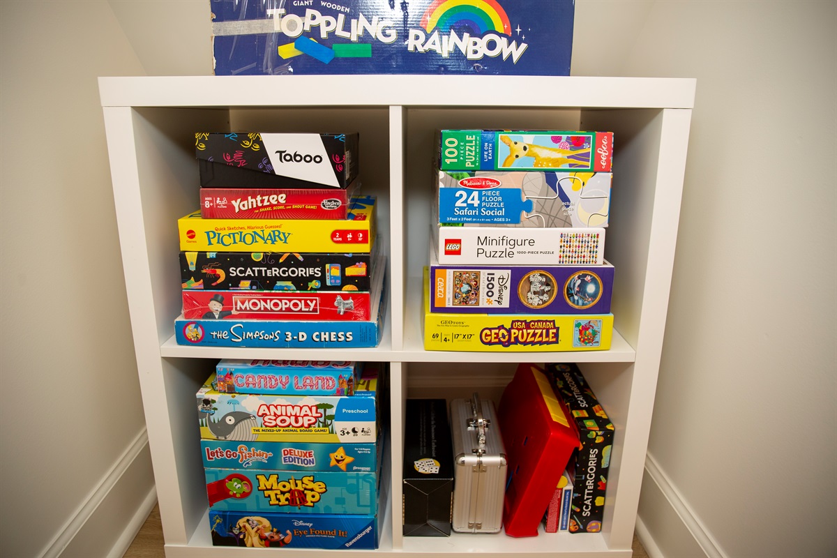 Stocked game cabinet ready for family tournaments and rainy‑day laughs.