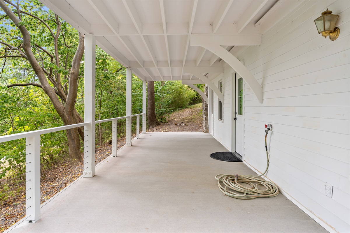 Spacious covered porch perfect for morning coffee or evening gatherings rain or shine.