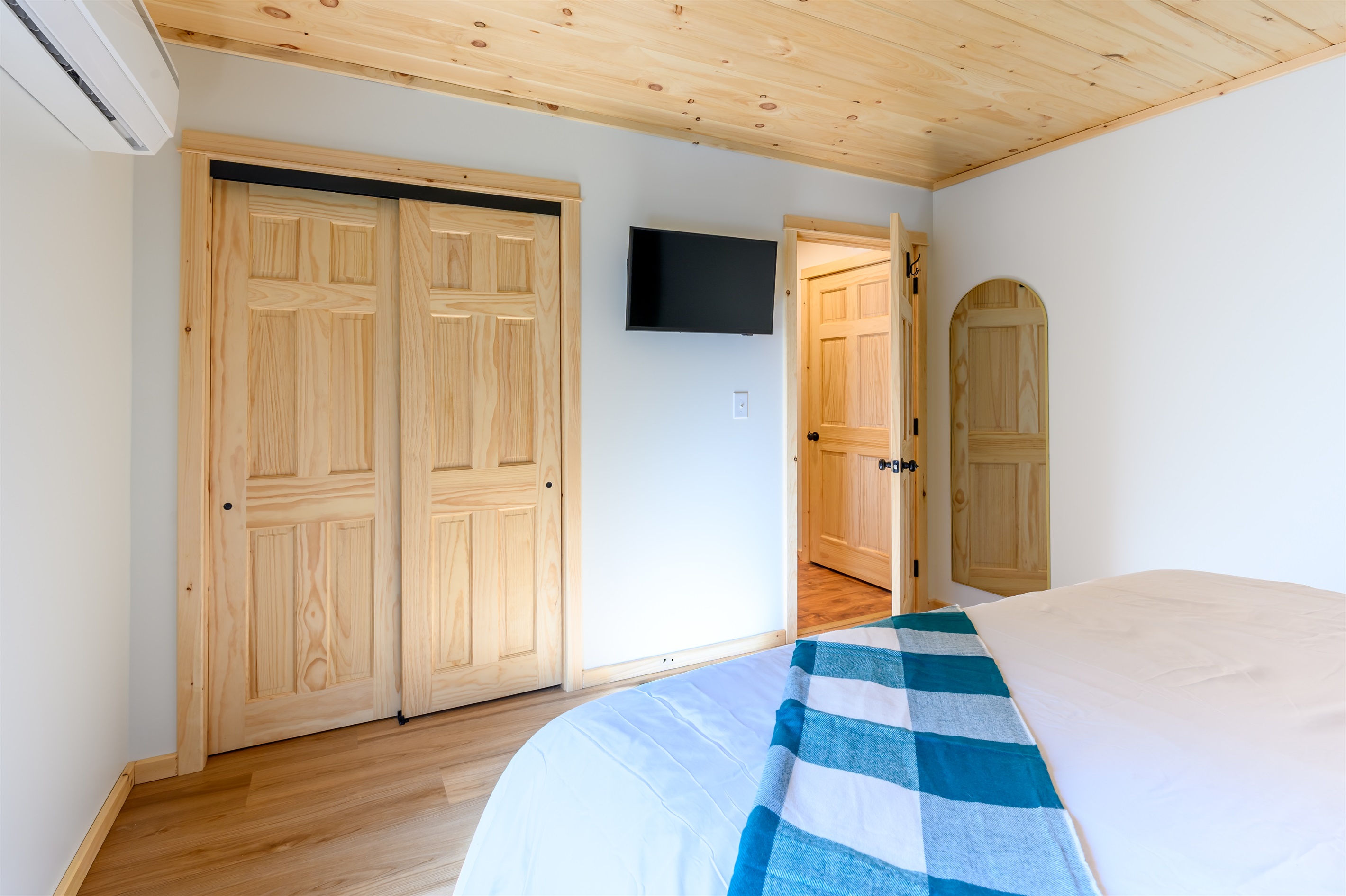 The King Bedroom features a full length mirror, a 32 inch smart tv, black out shades