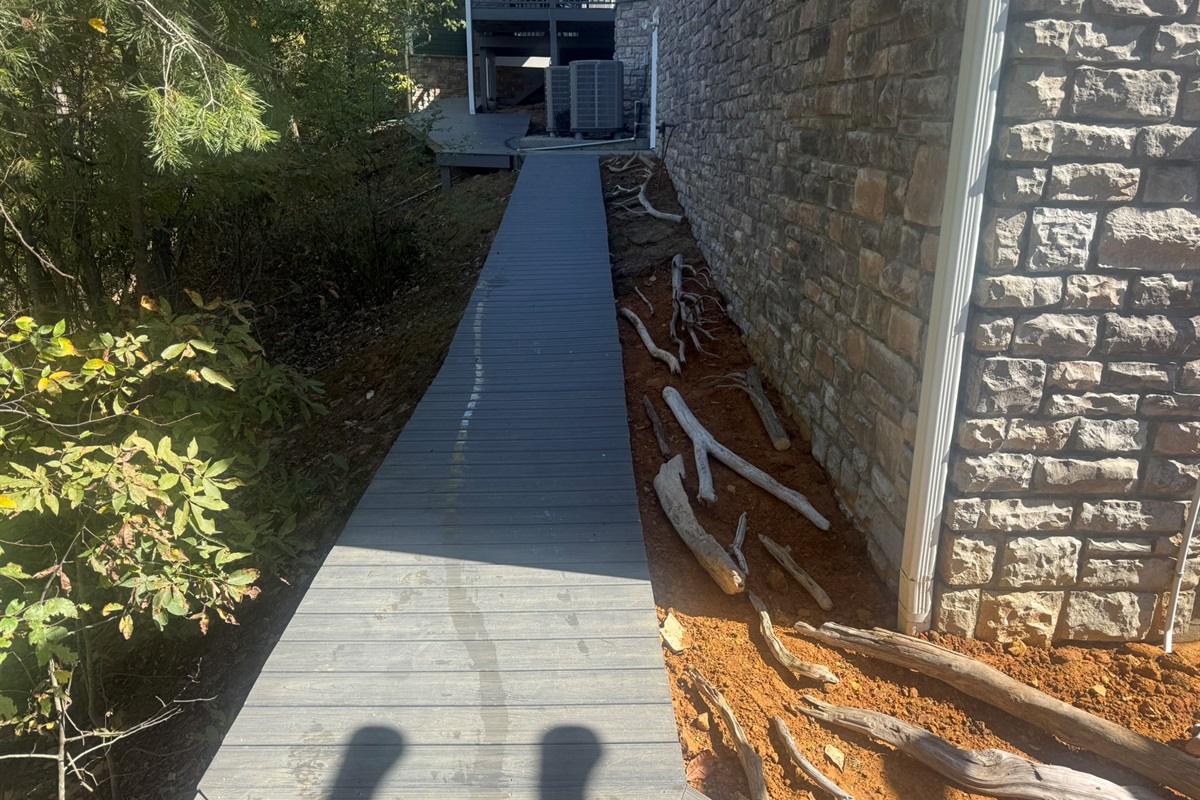 Exterior walkway from the front of the house to the back of the house