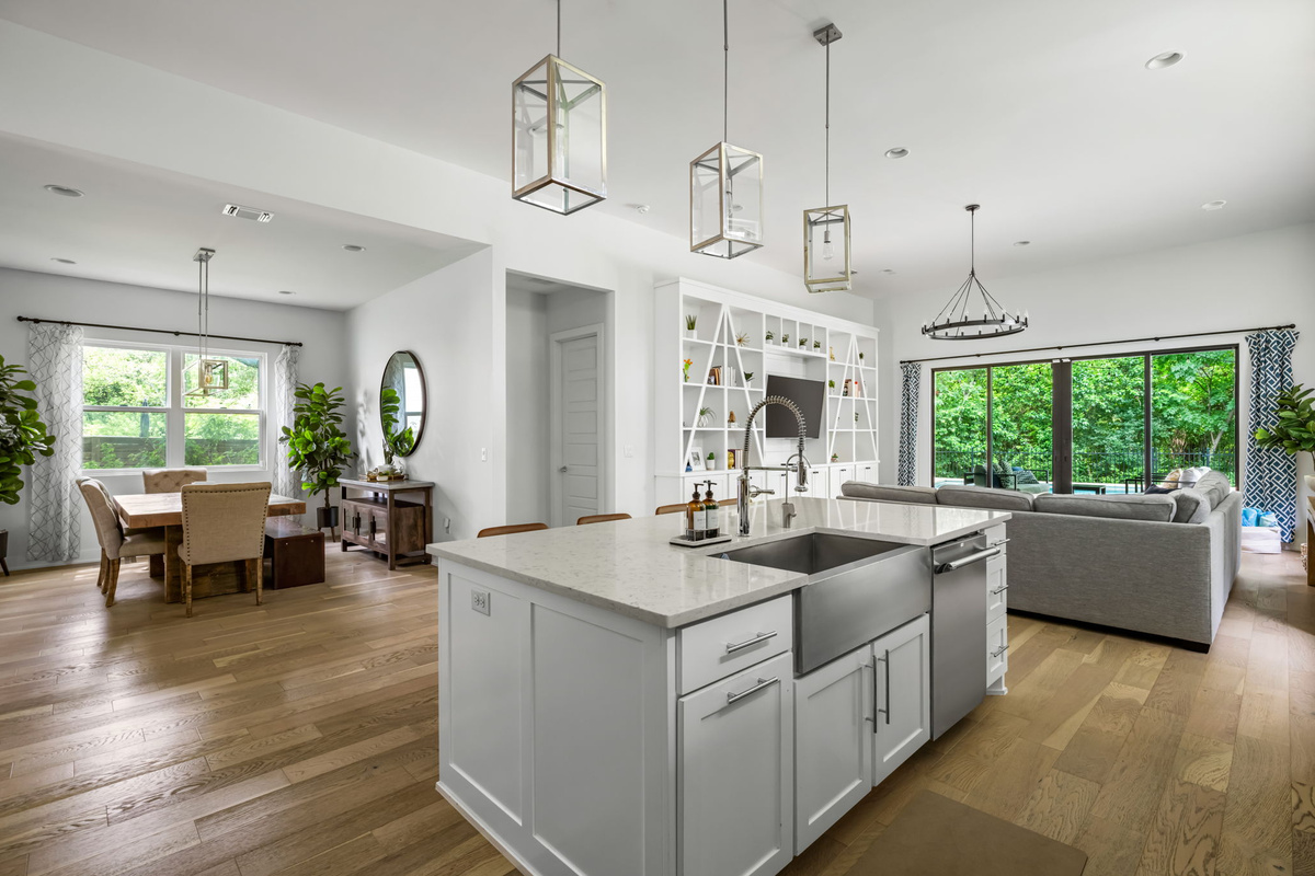 Bright, open-concept kitchen flowing seamlessly into the living and dining areas — ideal for hosting family and friends.