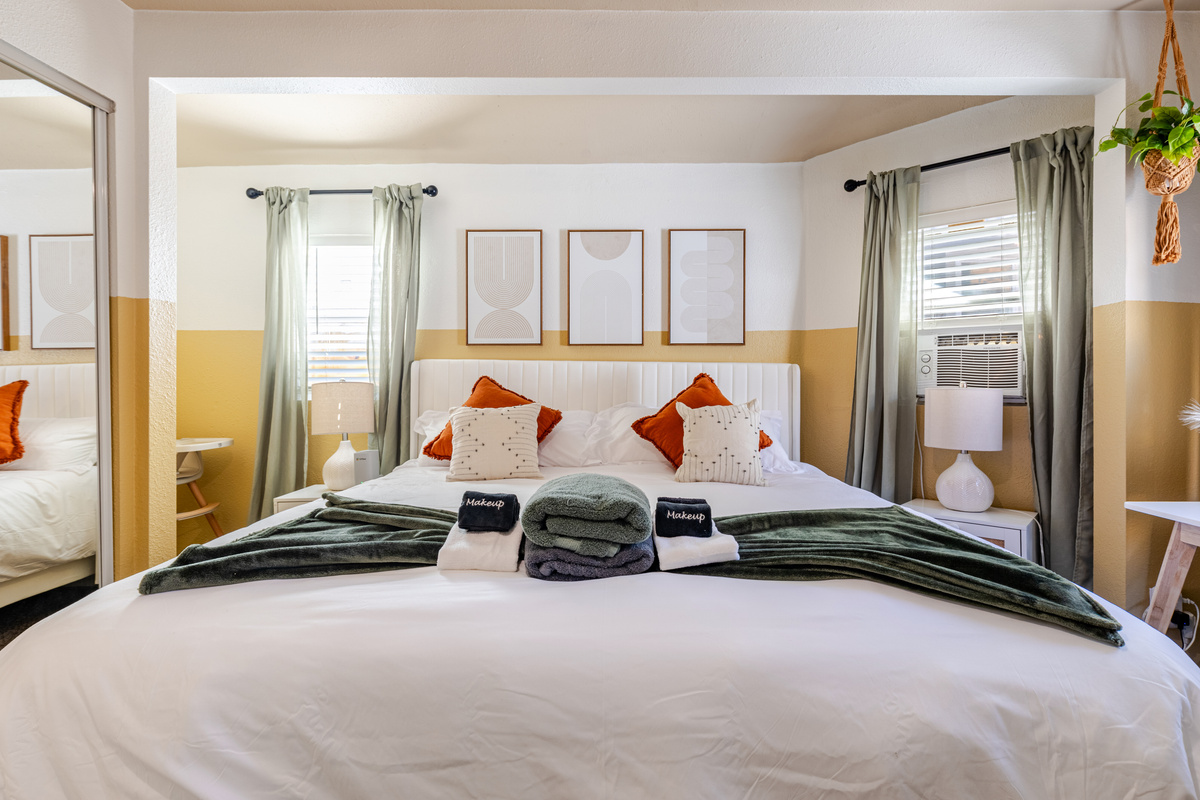 Bright, stylish space adorned with plush linens and inviting decor!
