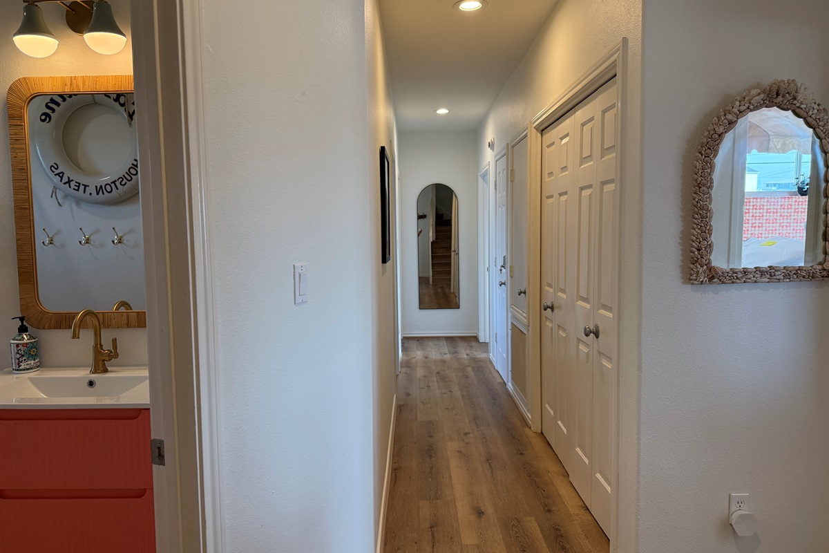 Off the main level hallway is the first full bathroom, and four bedrooms. 