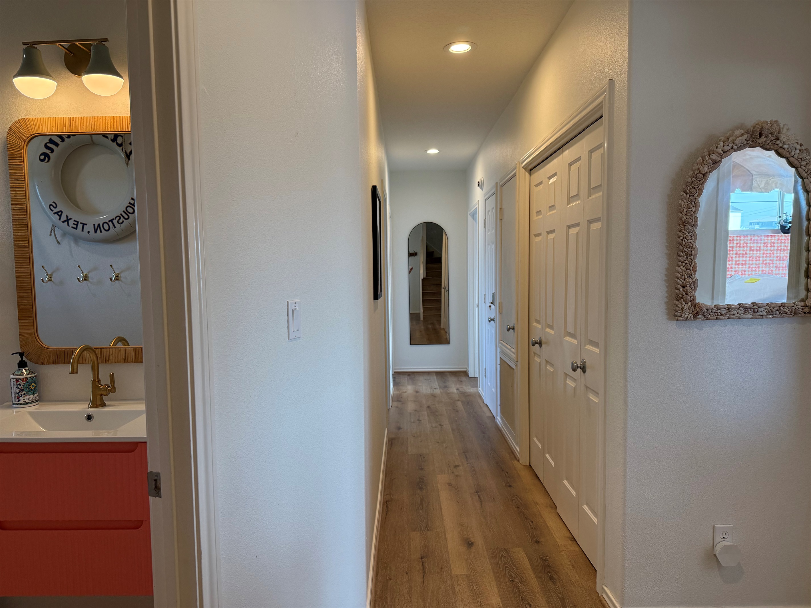 Off the main level hallway is the first full bathroom, and four bedrooms. 