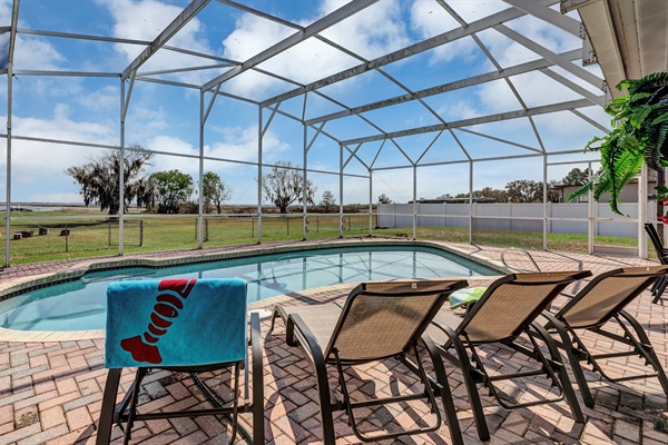 Heated screened in pool.