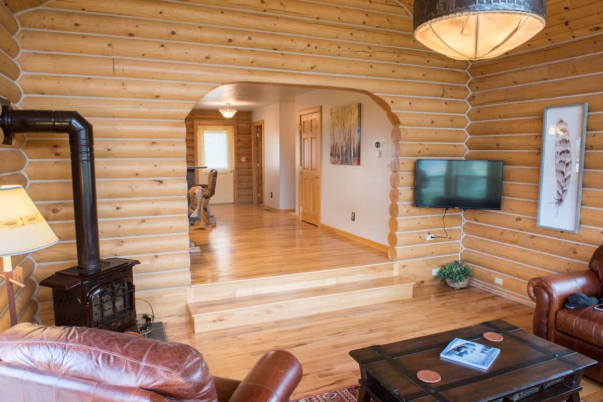 Spend time together in the warm, open family room which includes a traditional wood-burning stove, a comfortable seating area, and a flat screen TV.