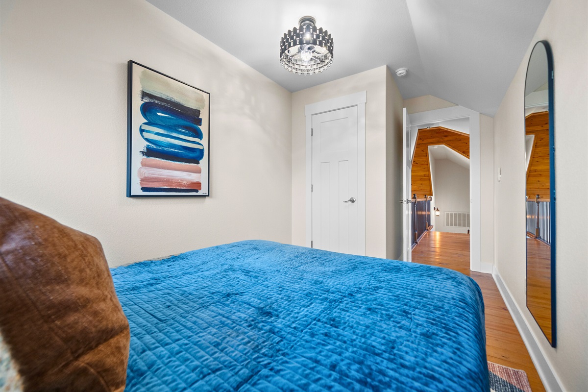 Soft textures and calming colors in this bedroom create a simple, inviting space to unwind at the end of the day.