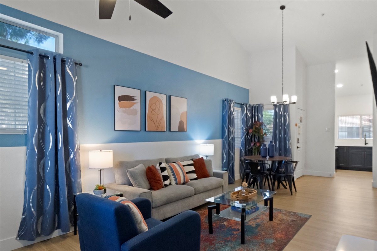 Experience comfort and style in this thoughtfully designed living room, complete with plush seating, elegant decor, high-speed Wi-Fi, and a large Smart TV for endless entertainment.