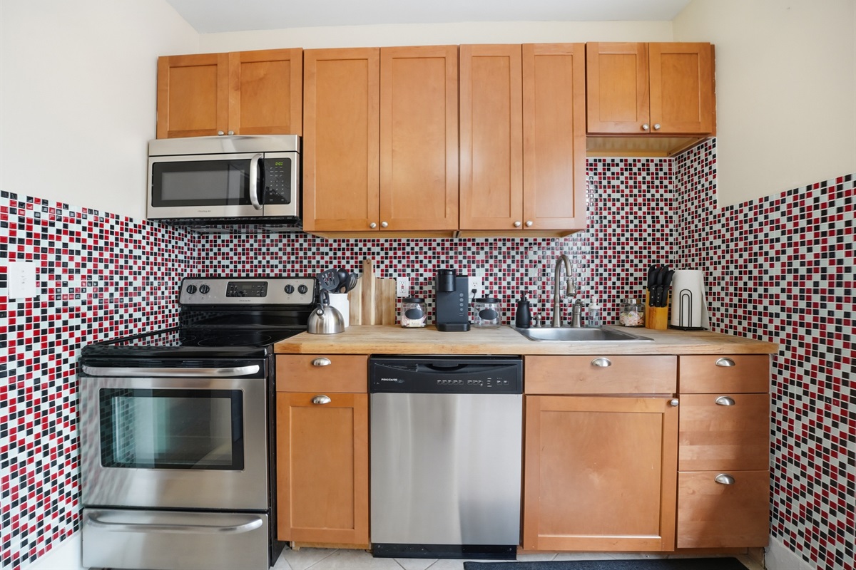 oven, microwave, coffee station and dishwasher