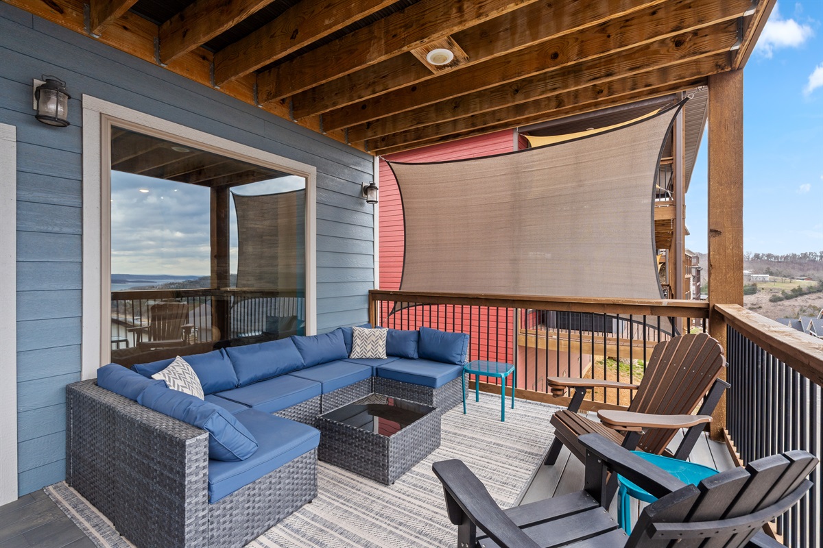 Spacious outdoor balcony with comfortable seating, ideal for enjoying sunsets and lake views!" 

