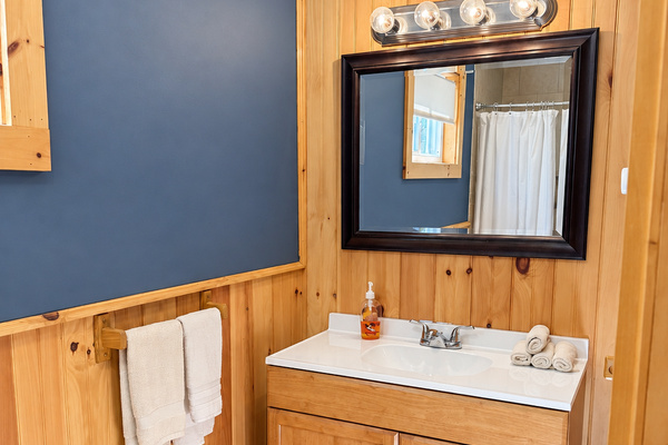 Spacious bathroom with tiled shower