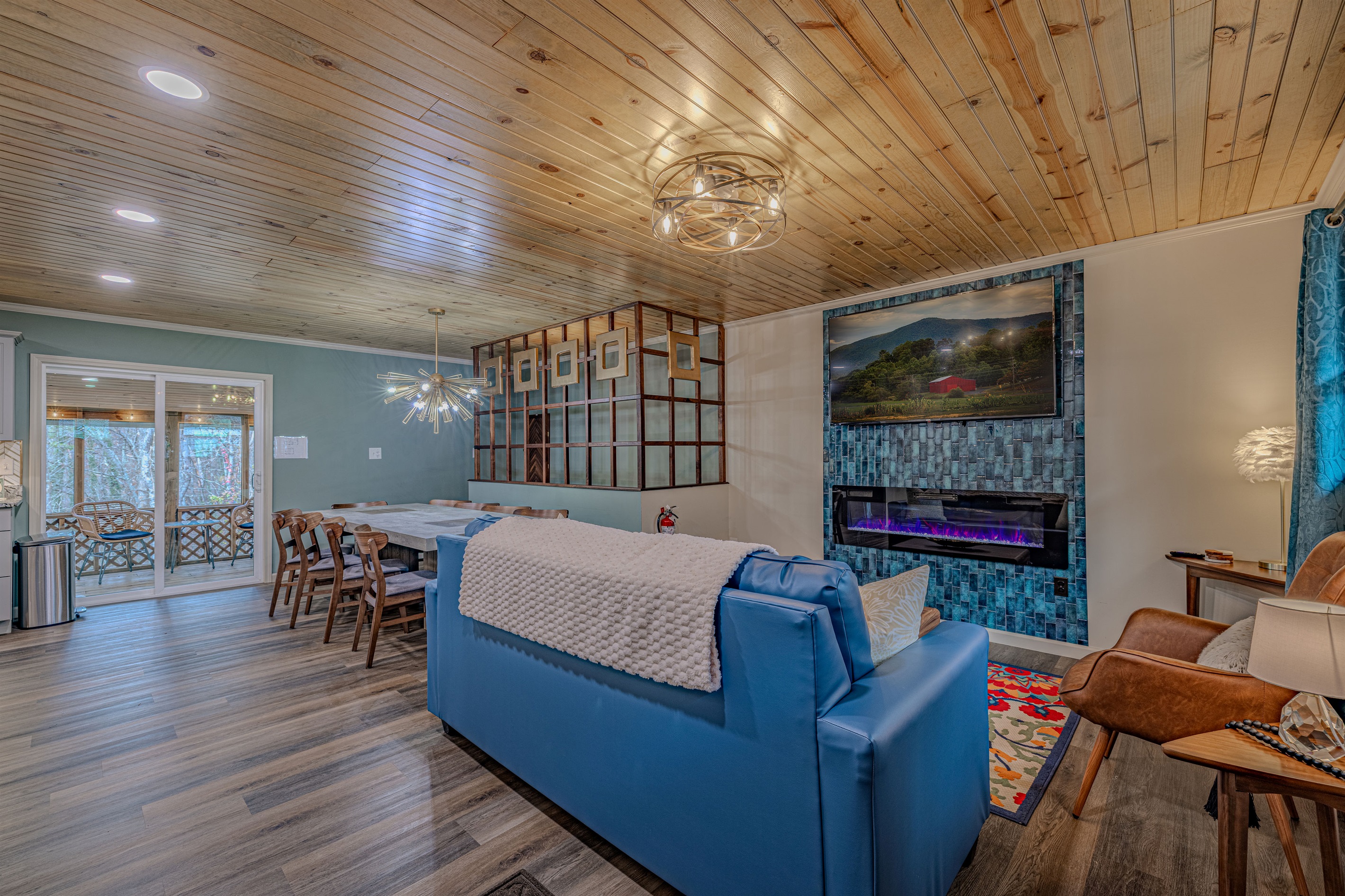 Style and function for your group. Relax by the electric fireplace while others socialize at the large dining table nearby.