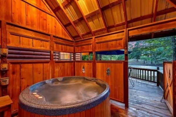 Private hot tub with enclosed space in case of rain.