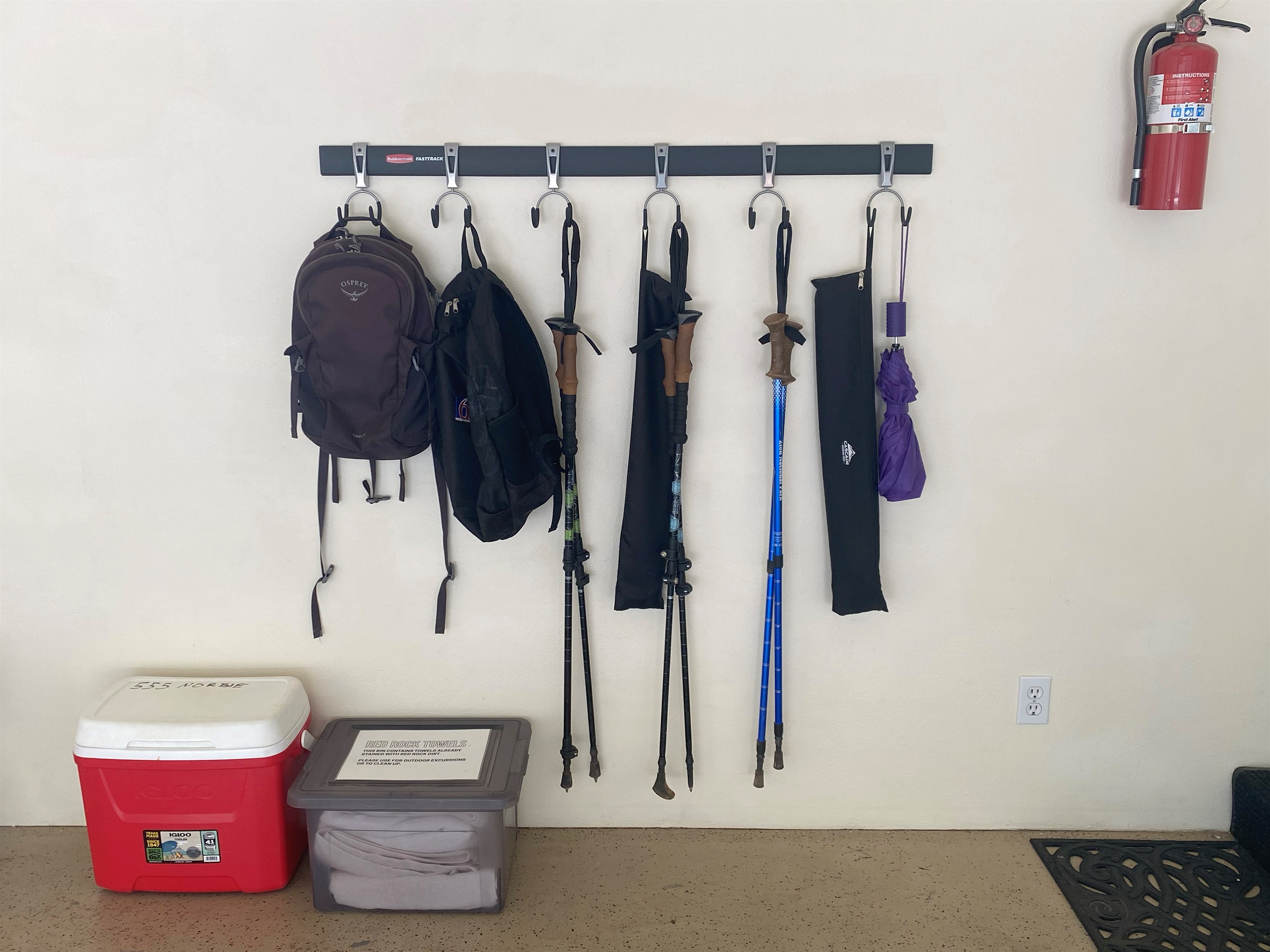 Hiking poles, backpacks, umbrella, cooler