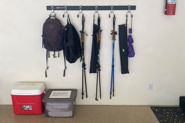 Hiking poles, backpacks, umbrella, cooler