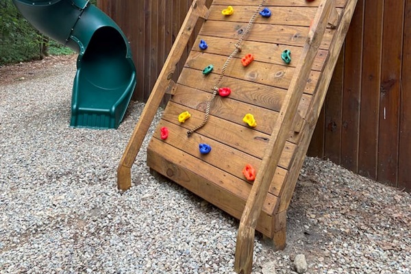 Kids and teens will love hours of adventure on the climbing wall and slide in the backyard.